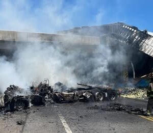 Semi-truck driver survived crash off overpass and explosion, highways closed for hours
